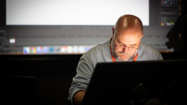 James Baxter visits DNEG - Photo (James Baxter working on a computer)