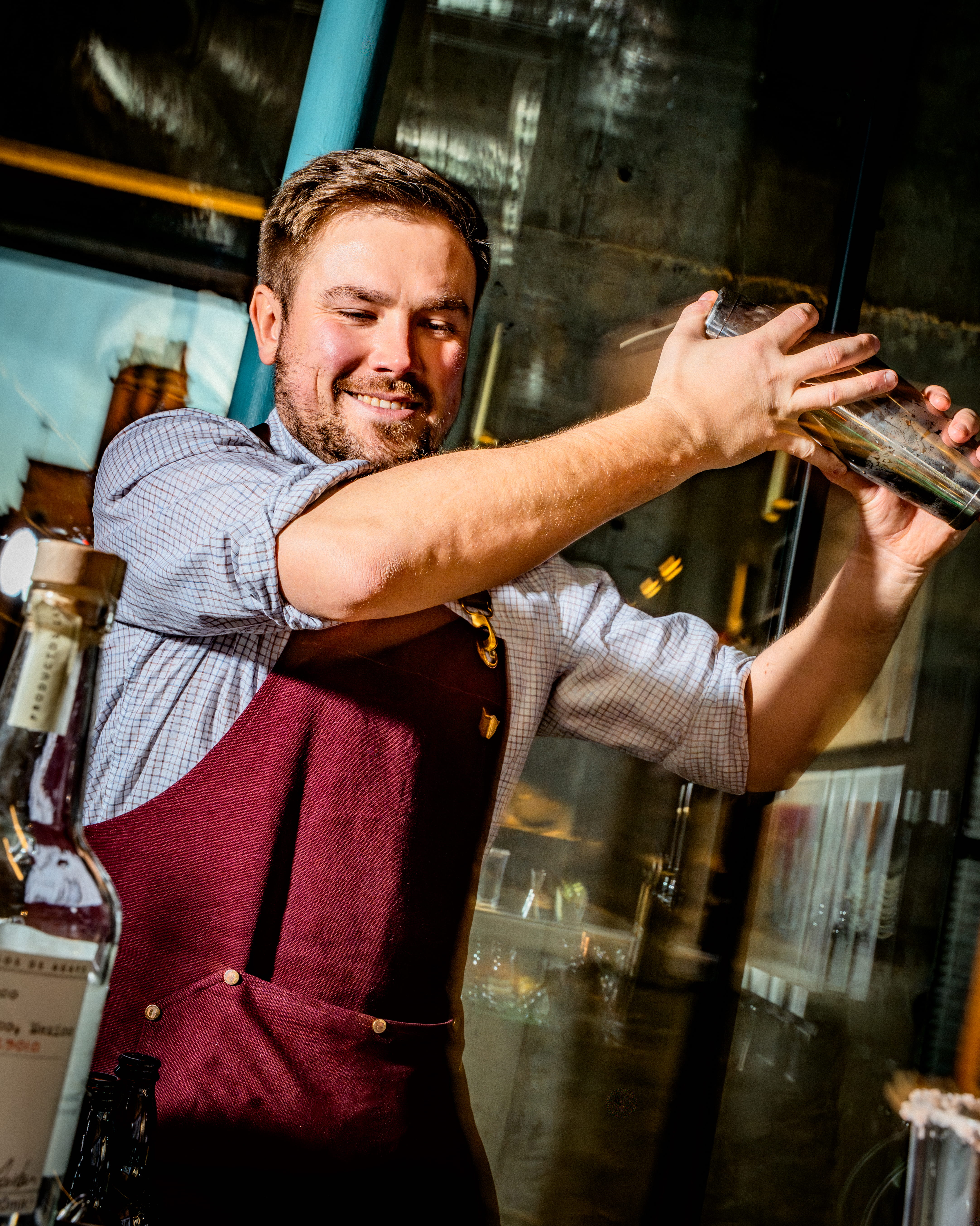 Bartender shakes a cocktail in the Guinness venue in Covent Garden London