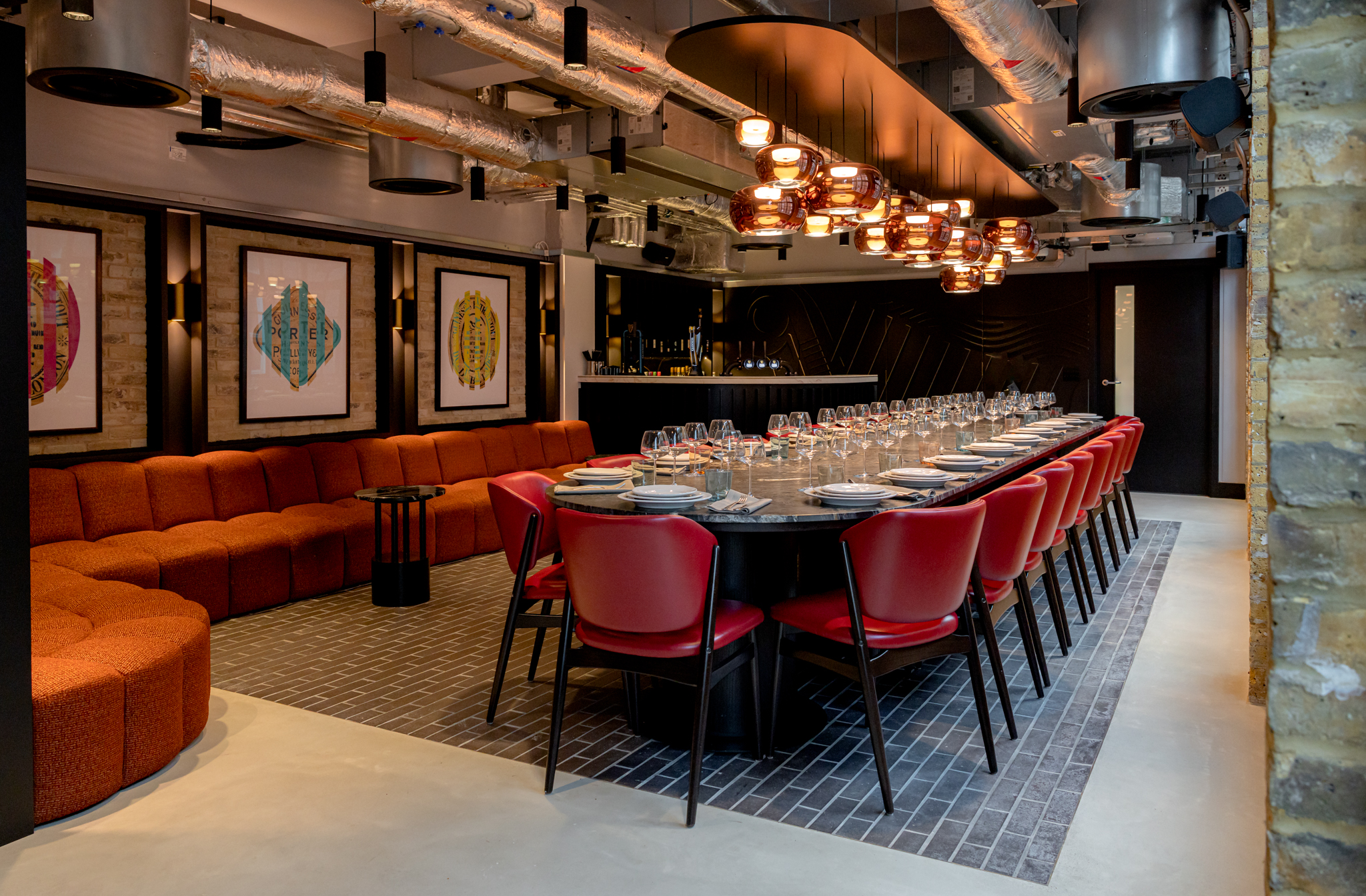 A long table with 24 seats is dressed and ready for guests in the private dining space in the Guinness restaurant in Covent Garden, London.