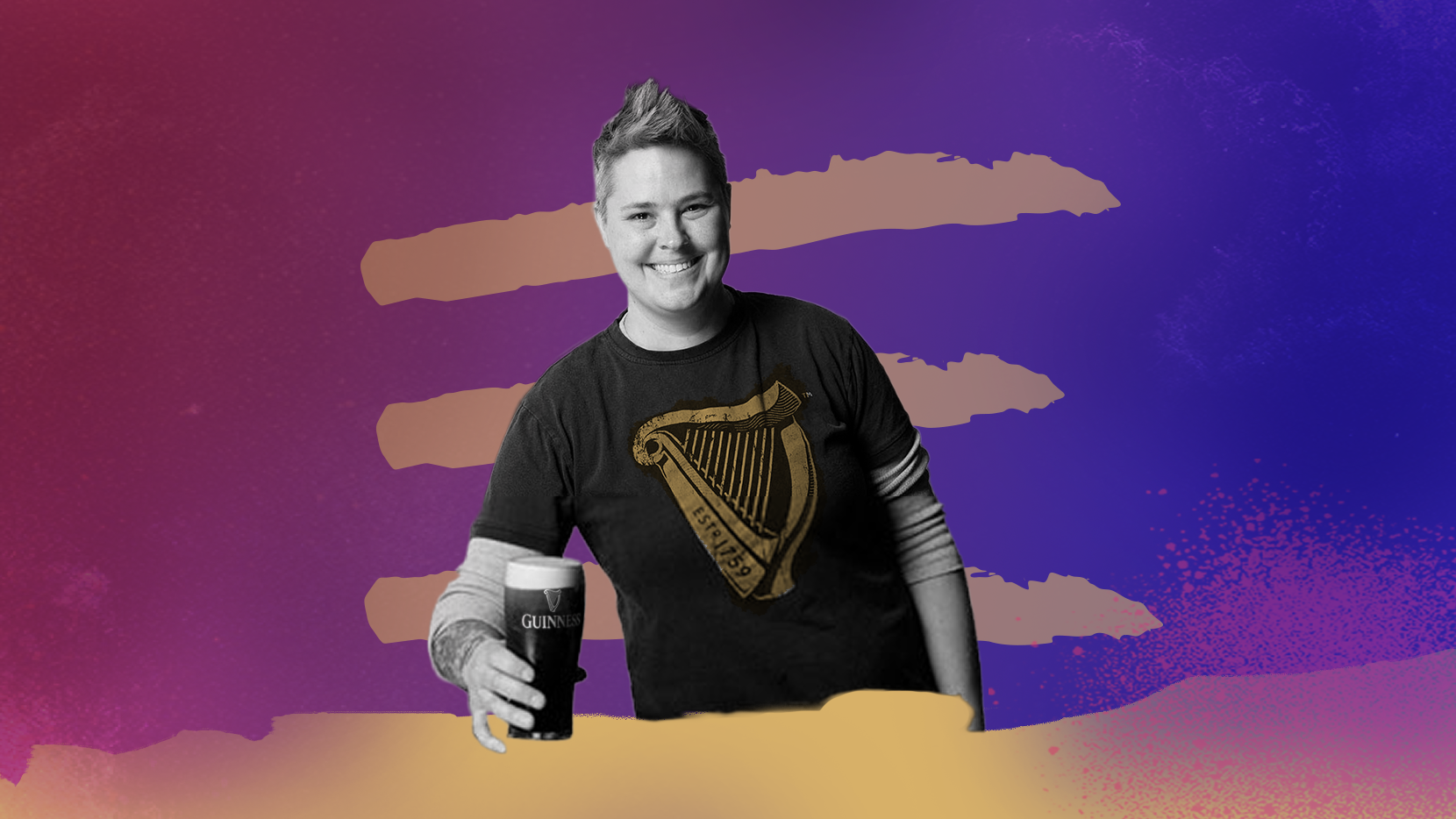 Master Brewer Hollie Stephenson smiles at the camera and poses with a pint of Guinness.