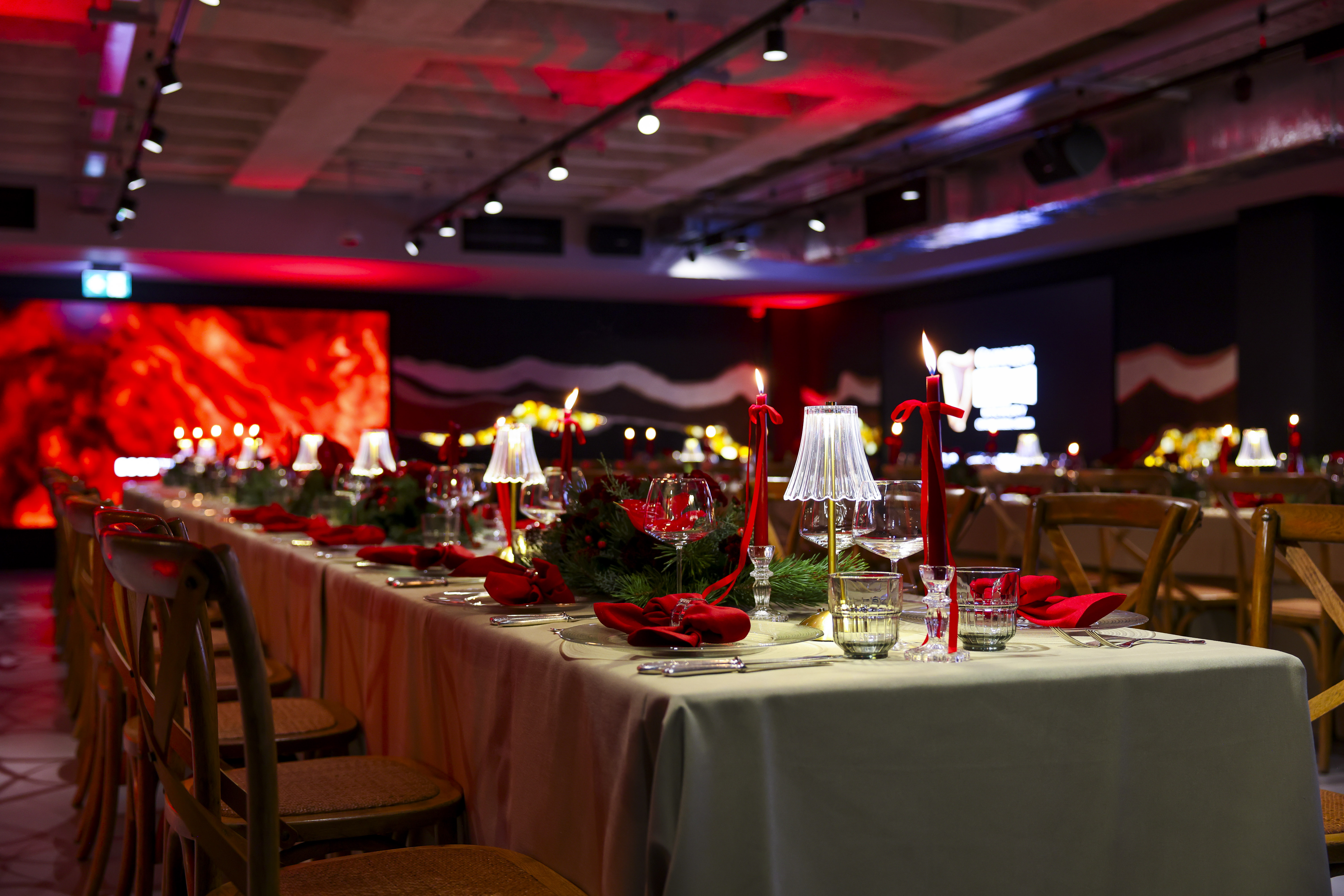 A Christmas dining table is set with Christmas decorations in the Guinness Vaults events space