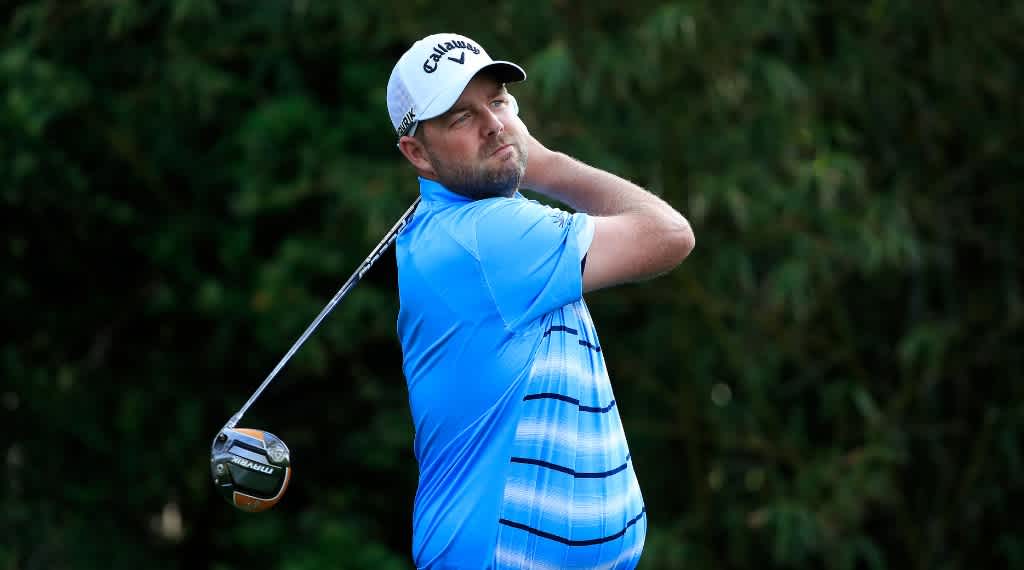 Marc Leishman tees off at the PGA Tour's Travelers Championship.