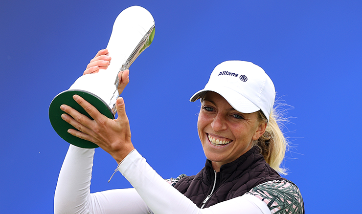 German Sophia Popov beams with pride in lifting the Women's Open trophy.