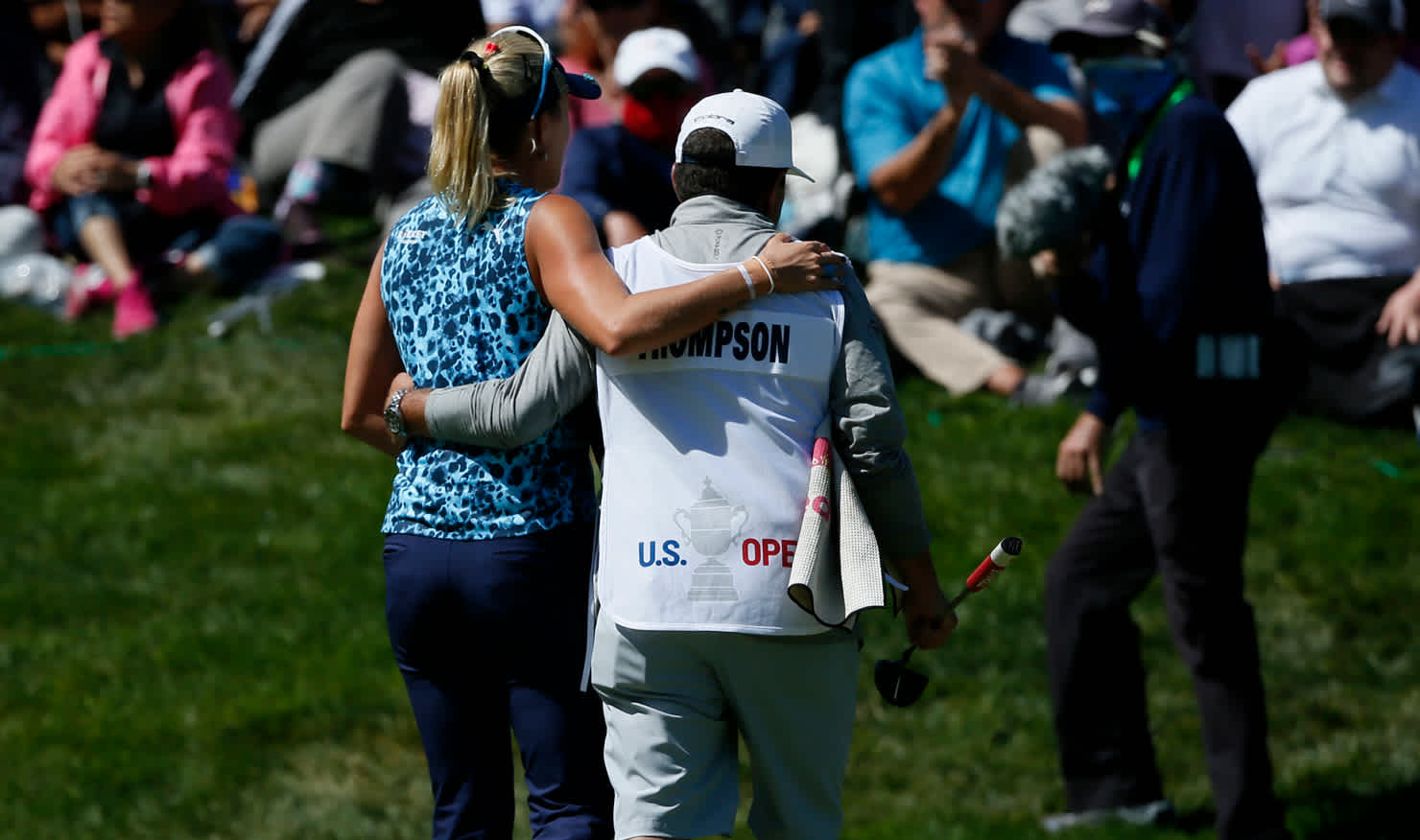 Lexi Thompson's caddie consoles her as she walks from the 72nd green and a costly bogey.