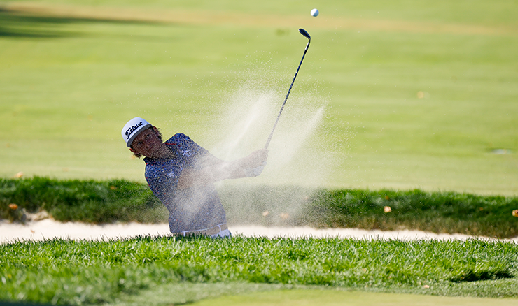 Cam Smith blasts from the bunker at the 16th hole. Picture: USGA