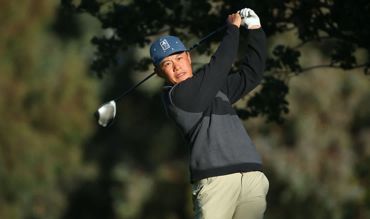 Jeffrey Guan launches into a drive at Gold Creek today. Picture: DAVID TEASE