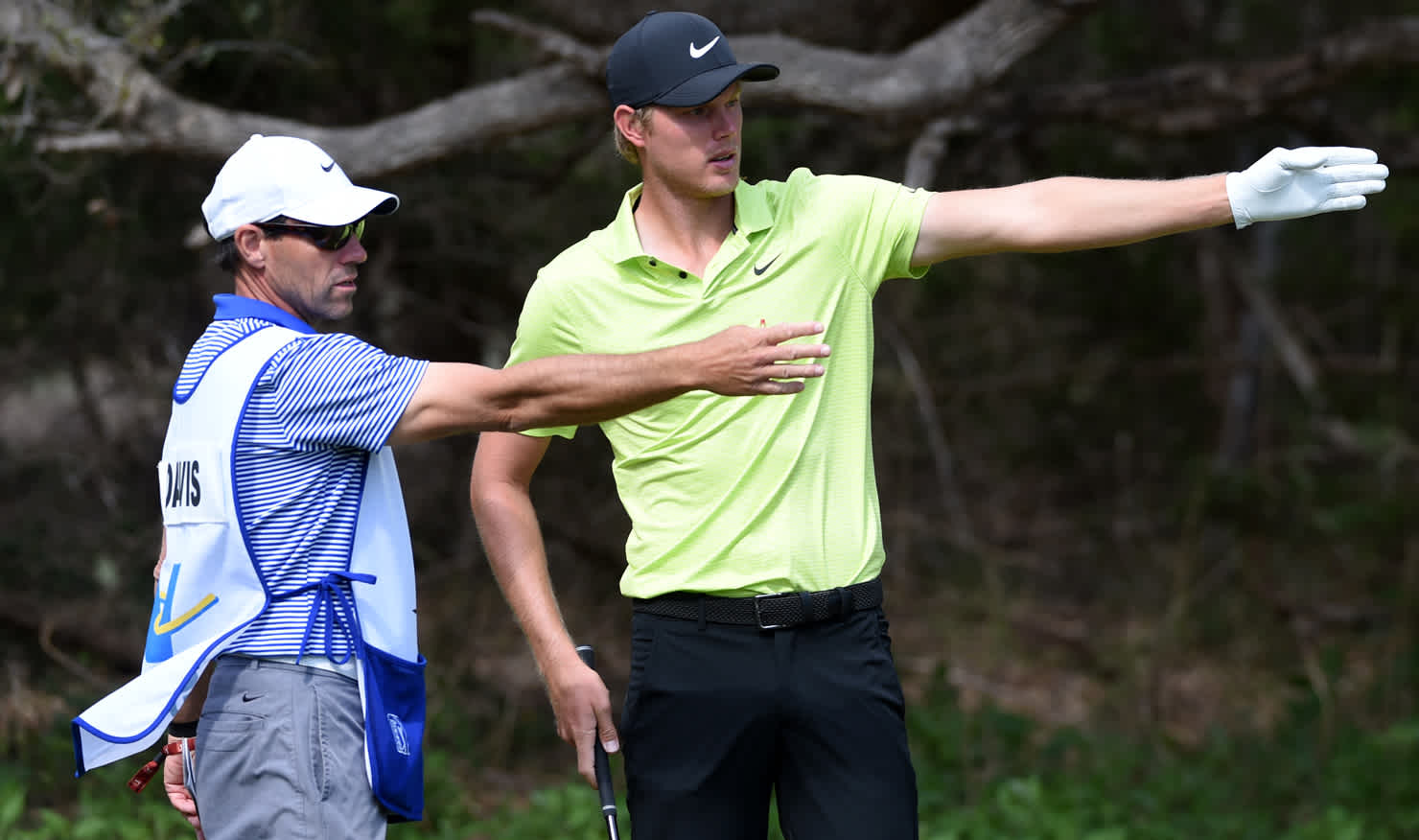 Winning combination ... caddie Andrew Tschudin gives Cam Davis a final pre-shot pointer.