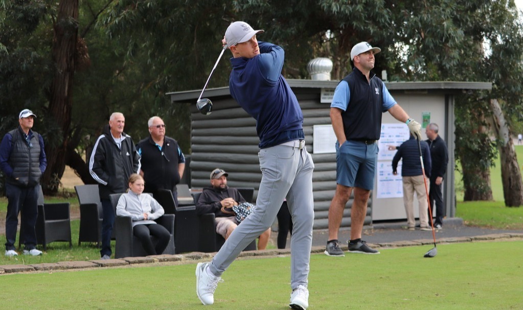 Player is teeing off on the first hole of an event