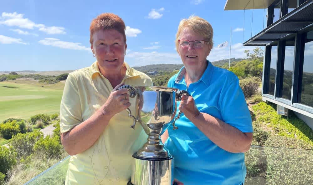 Women's winners Susan Barber and Lynette Vildovas holding their trophy