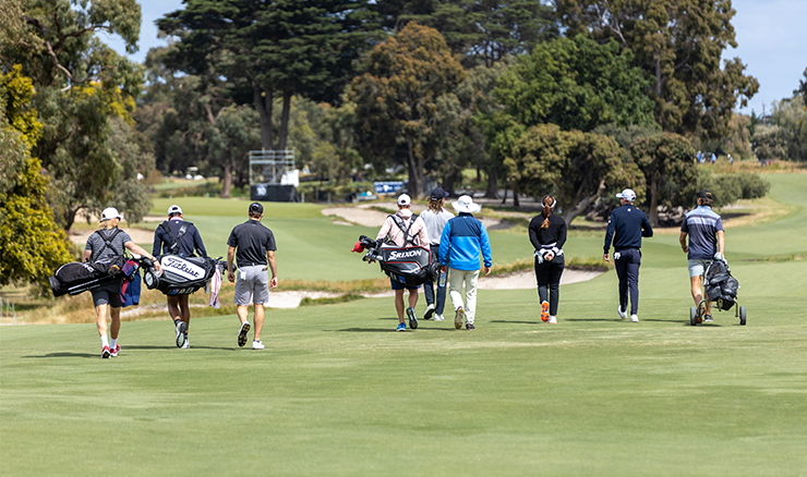 Practice round group walking the 10th hole at Victoria.