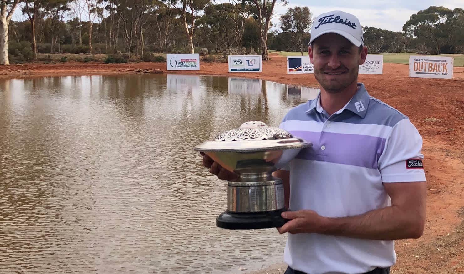 Jarryd Felton finally gets his hands on the WA PGA Championship trophy. Picture: PGA of Australia