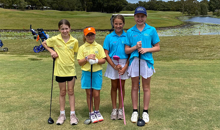 Four AGF scholarship girls loving hitting the golf course.