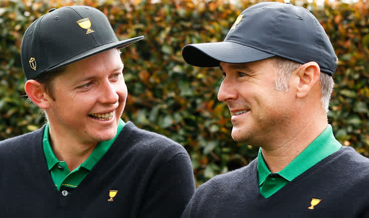 Trevor Immelman shares a joke with Aussie Cam Smith at Royal Melbourne during the 2019 Presidents Cup.