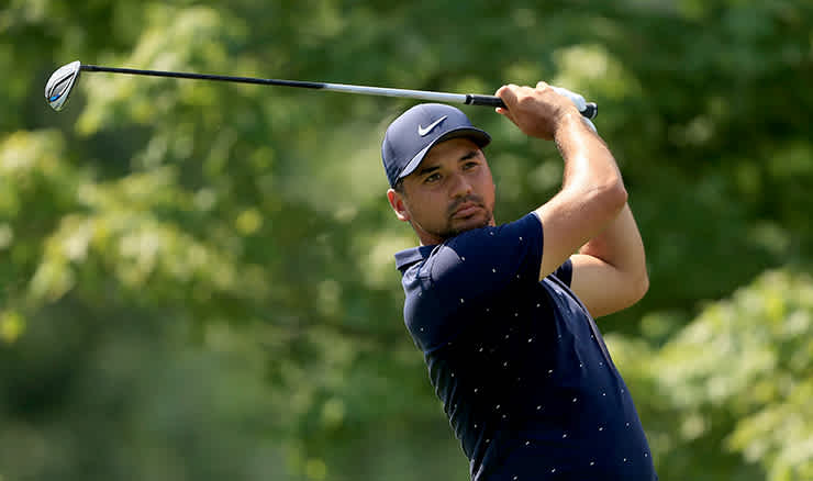 Jason Day eyes his approach at Muirfield Village today.