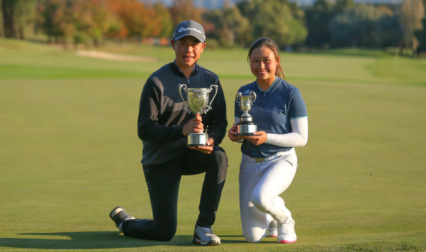 Jeffrey Guan and Jeneath Wong show off their national junior trophies at Gold Creek. Picture: DAVID TEASE