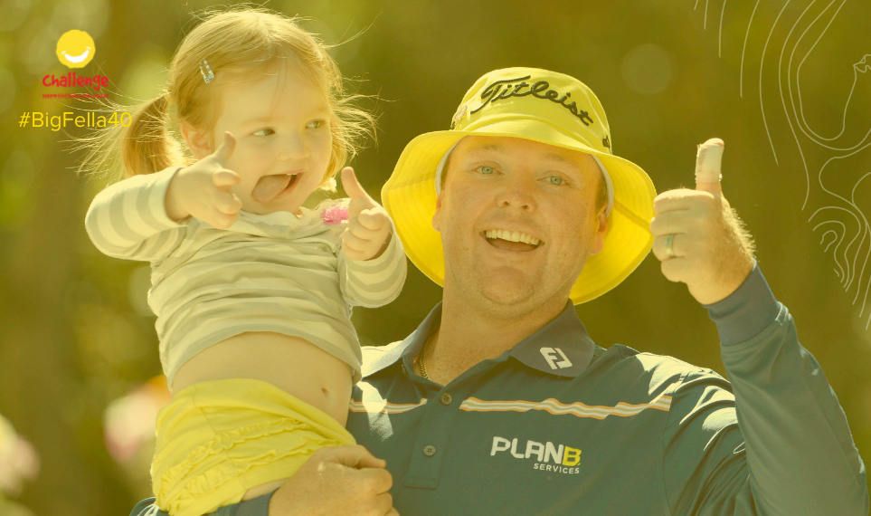 Jarrod Lyle holds his daughter and gives a big thumbs up.