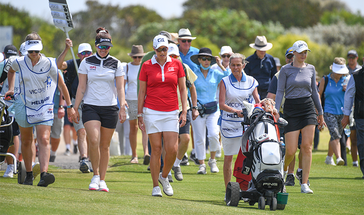 A healthy crowd following Hannah Green.