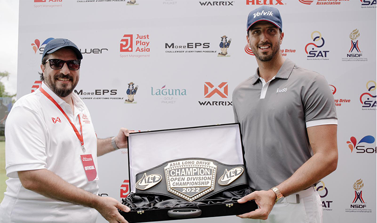 Steffan Scutti receives his champion's belt for winning the Asia Long Drive Championship.