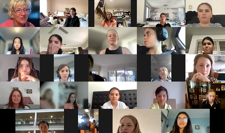 A screenful of girl golfers hear from Grace Kim (bottom right).