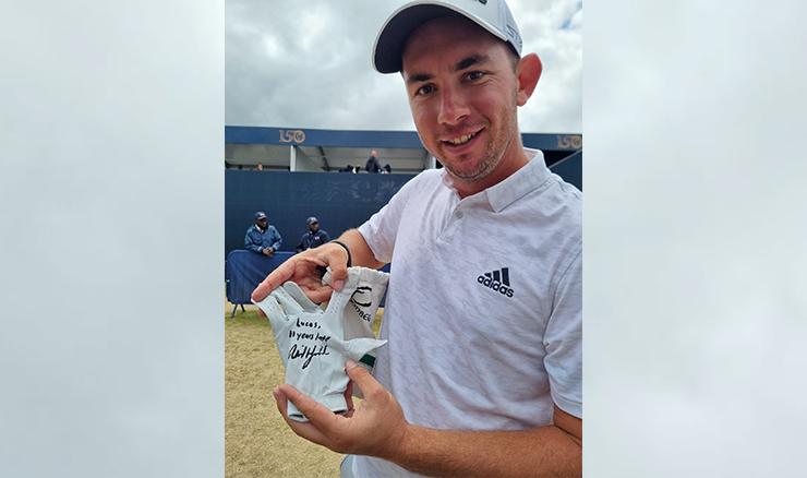 Lucas Herbert with his glove signed by Phil Mickelson with the words 'Lucas, 11 years too late'.