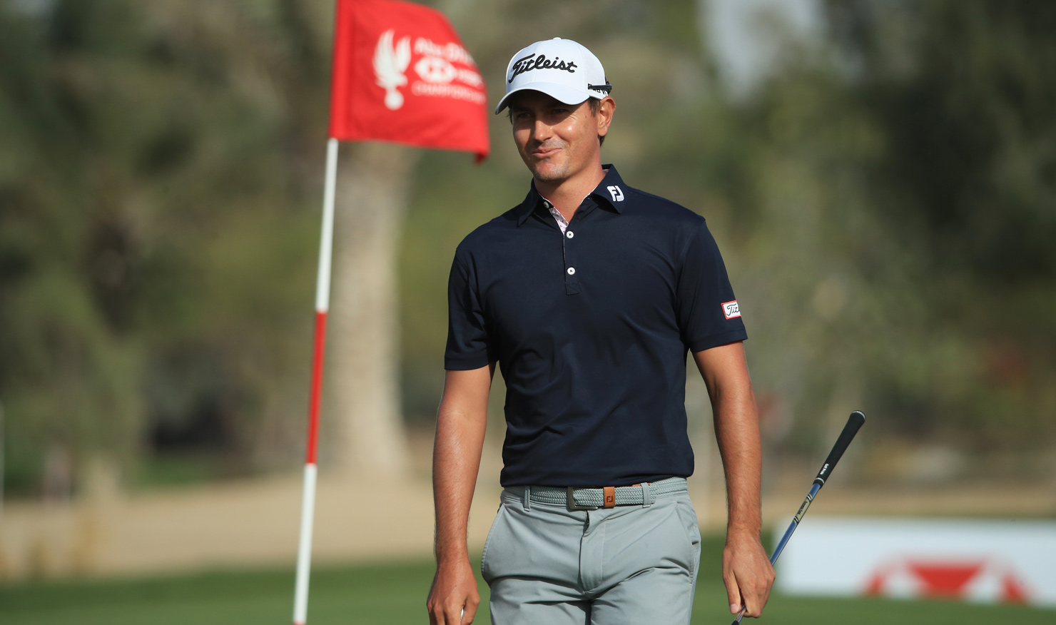 Jason Scrivener can't hide his smile after chipping in for birdie on the 16th hole in Abu Dhabi.