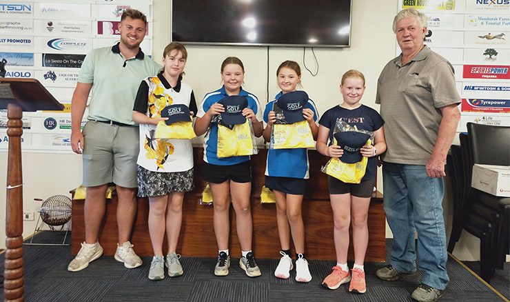 Scholarship recipients receive their uniforms at their induction session with Aaron Crotty (left) and Club President, Tony Preston (right). 