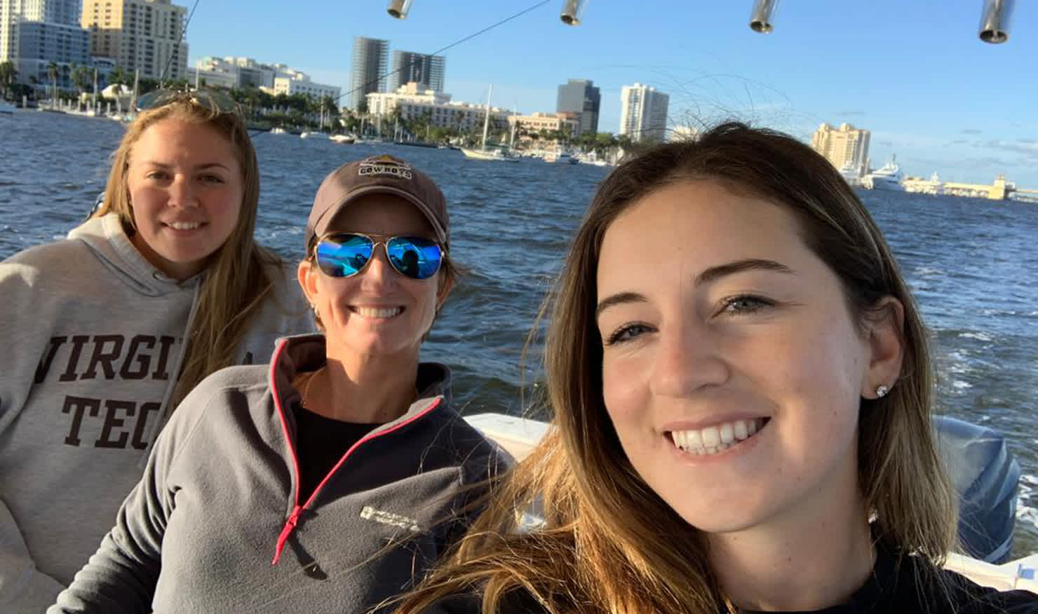 Emily Mahar (left) and Gabi Ruffels (right) get out with captain Karrie Webb on her boat in Florida.