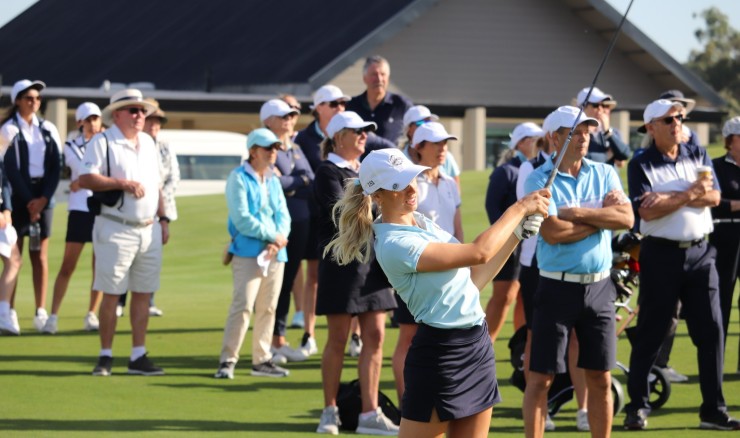player hitting a golf ball