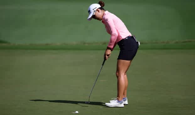 Minjee Lee sinks another putt on her way to 67 in Taiwan yesterday.