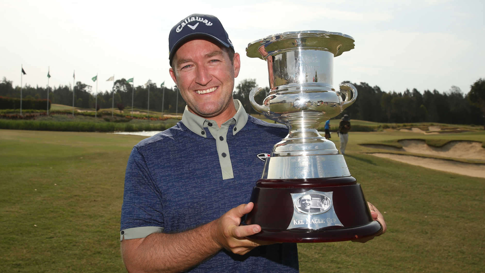 2019 champ Josh Younger proudly shows off the NSW Open trophy.