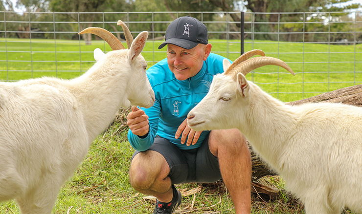 Garth Cusick with two of the 'Little Boys', the goats who were the first to arrive on site at Eastern Sward.