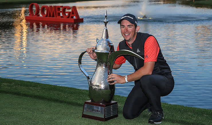 Lucas Herbert proudly displays his first professional trophy in Dubai.