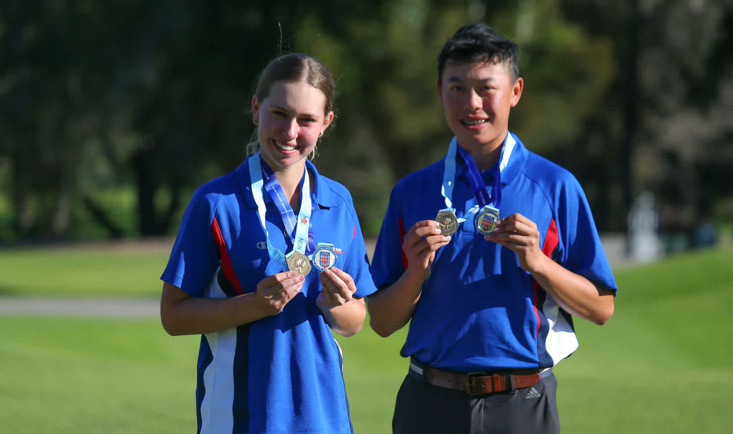 Charlotte Perkins and Jeffrey Guan proudly show their CHS trophies.