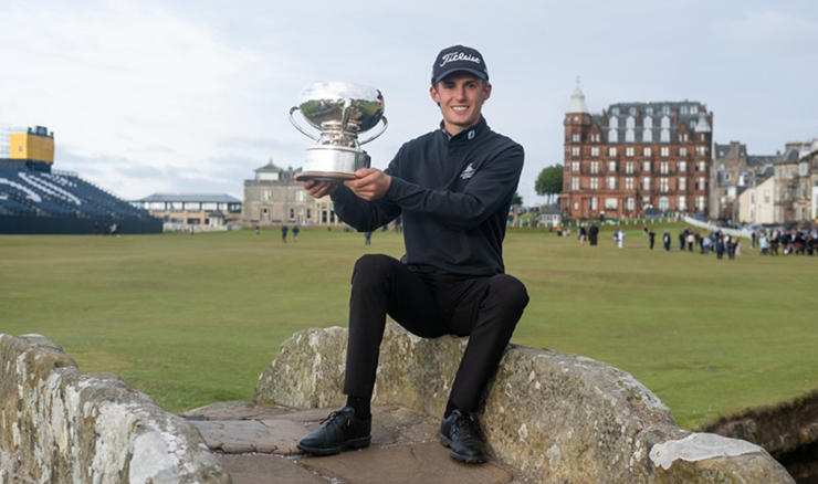 Connor McKinney with the Links Trophy on the Swilcan Bridge.