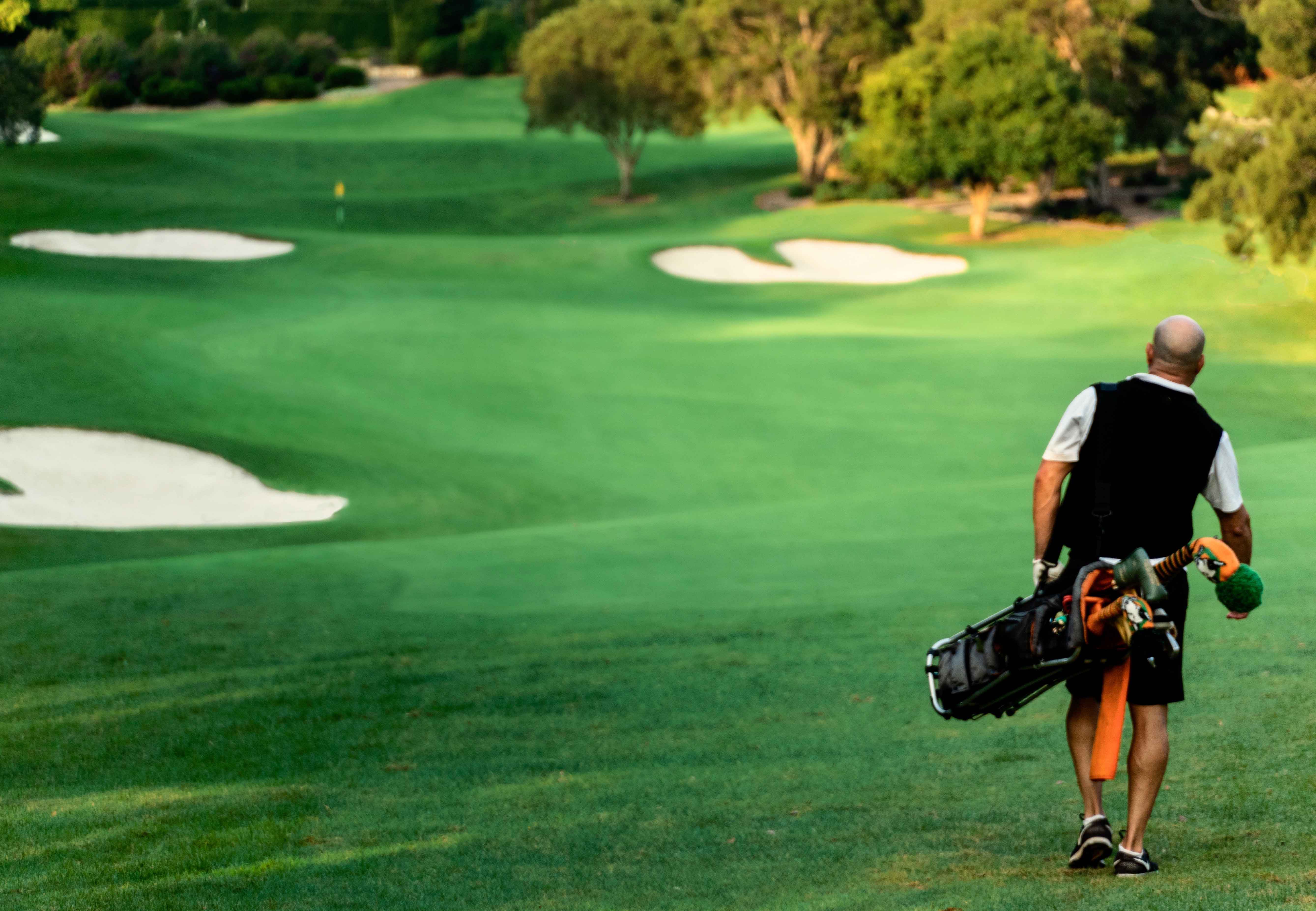 Man walking fairway