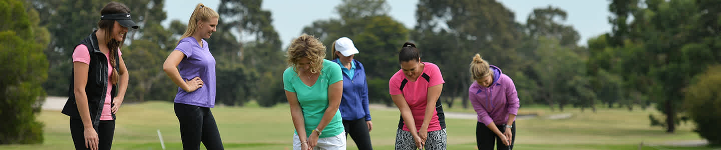 Women playing golf