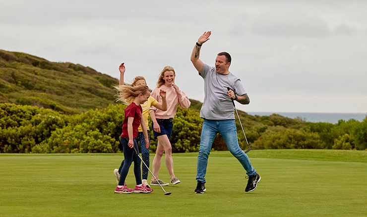 Family playing golf.