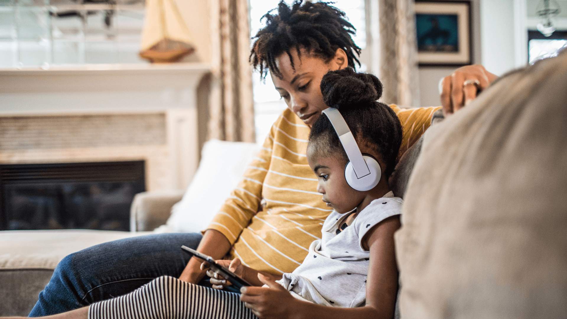 a parent and child listen to music