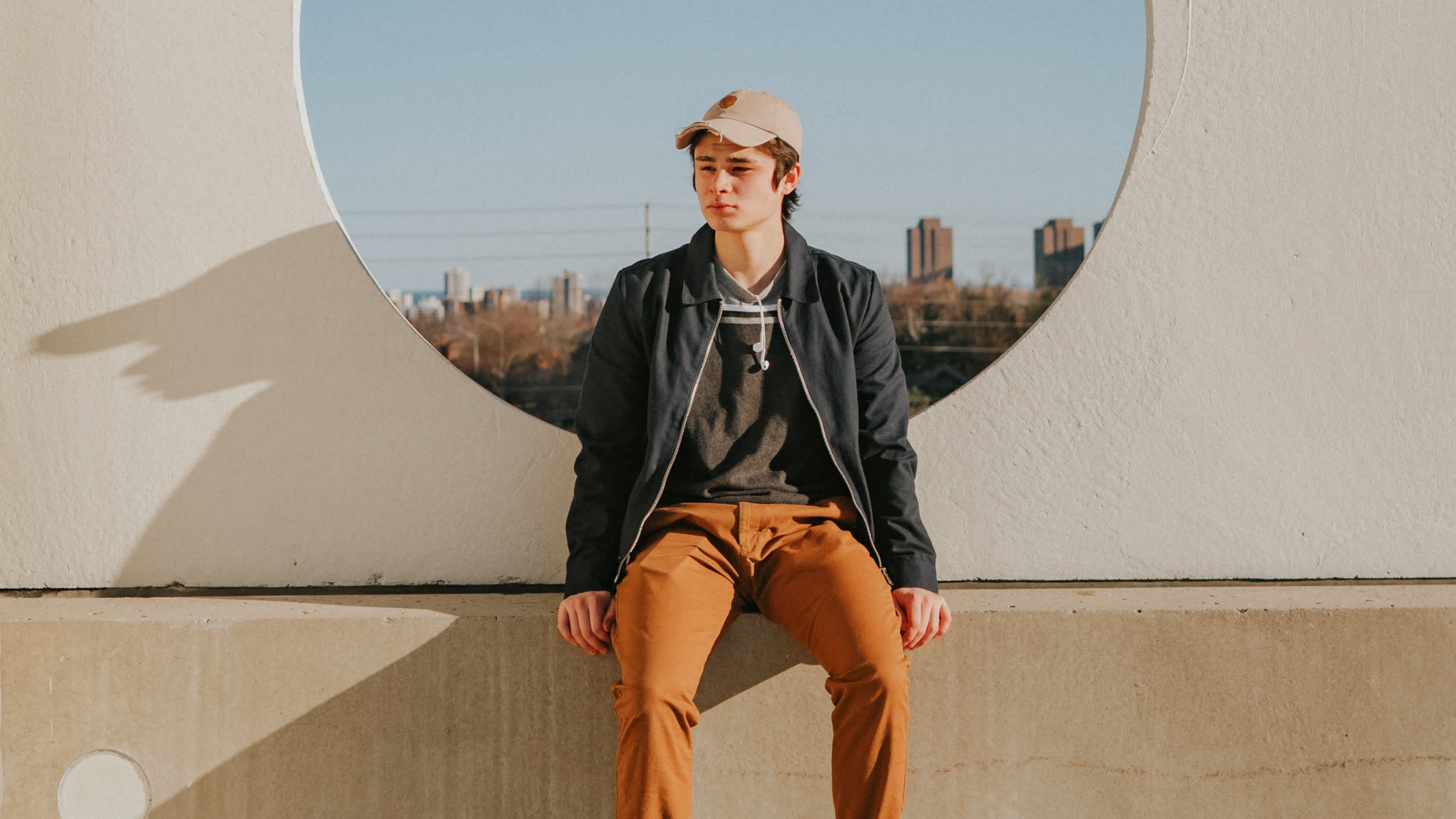 man sitting on a wall