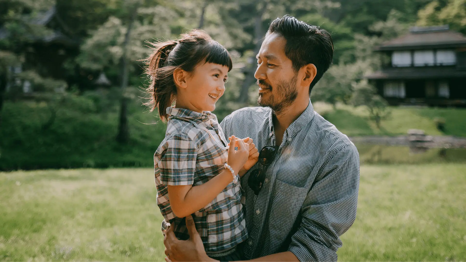 Father holding daughter