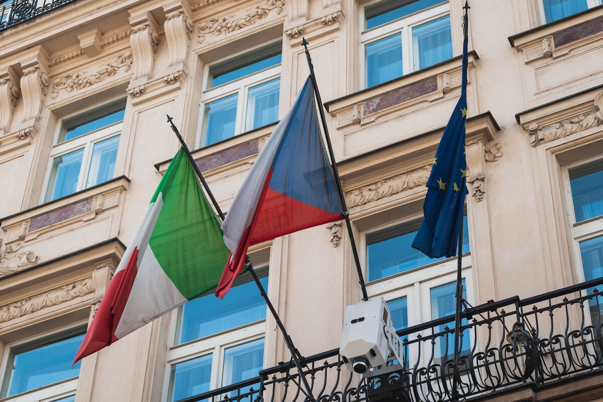 Italian, Czech, and EU flags.