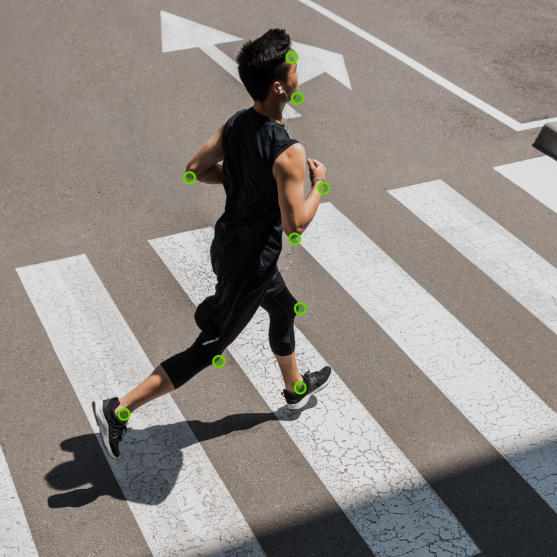 AI software is tracking body movements of a running man in a video