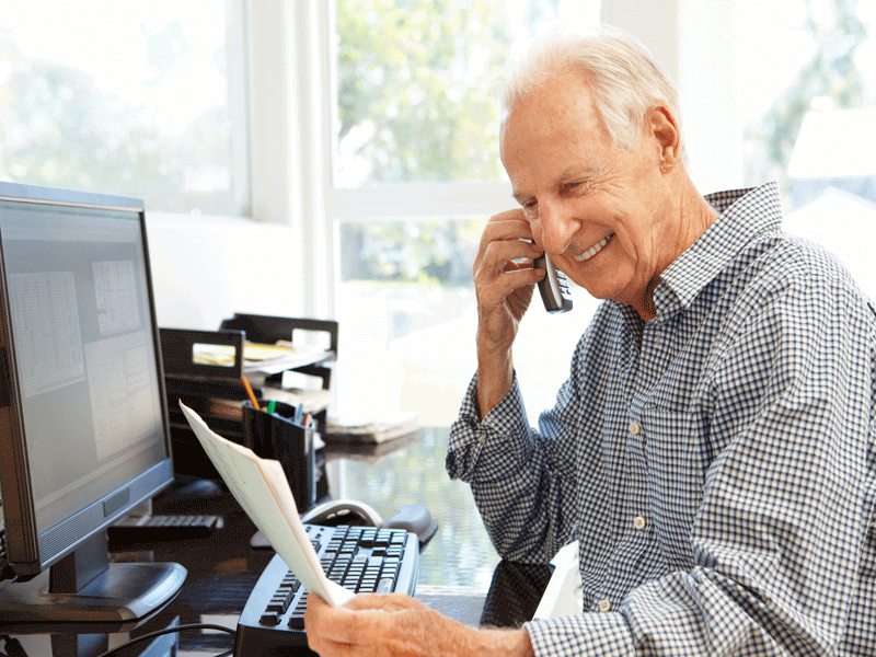 Older man calling customer service