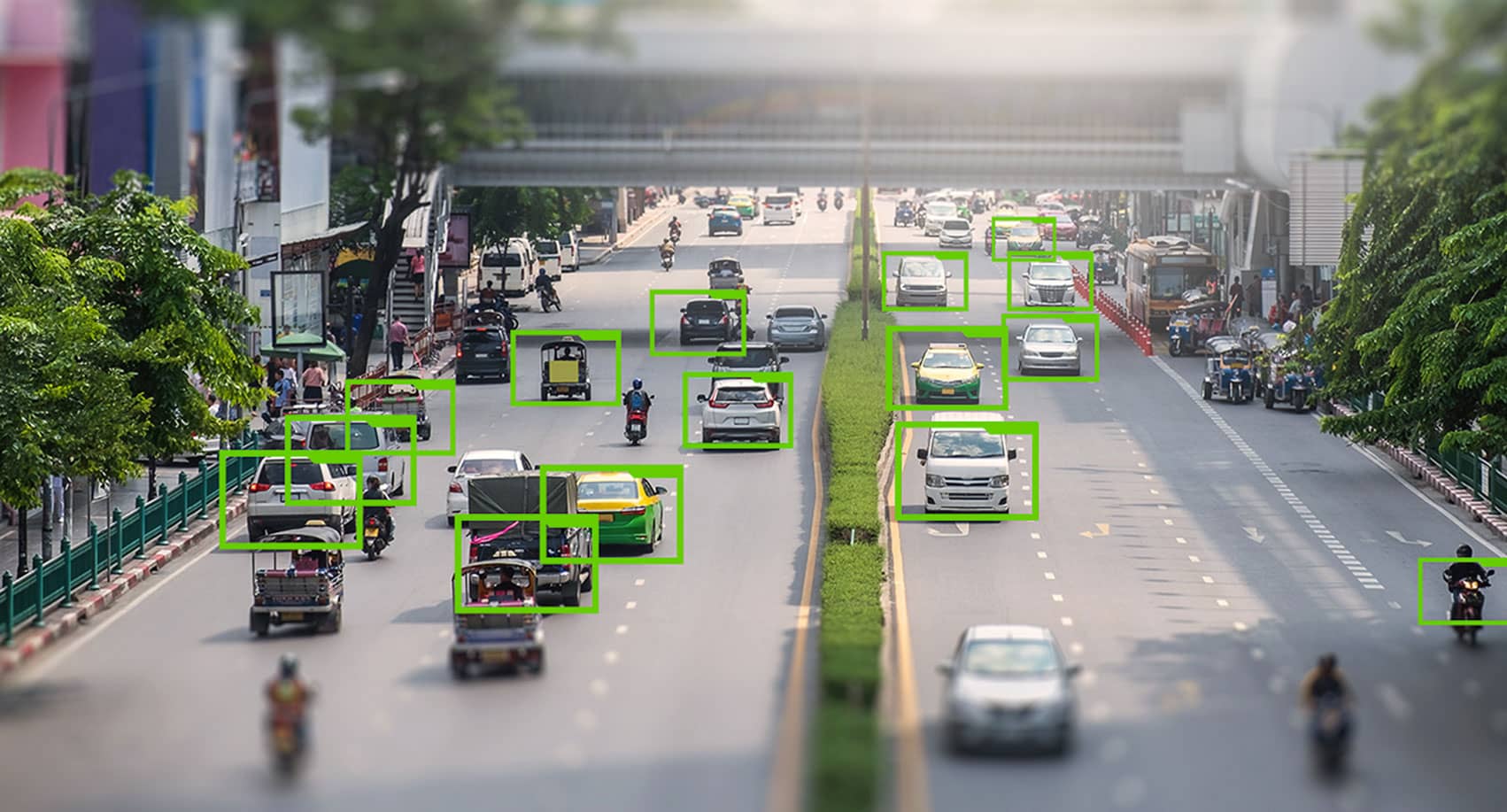 A busy street with traffic and people, which have been highlighted for AI data software