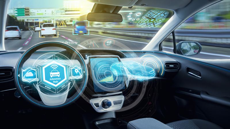 An autonomous vehicle shown driving on a busy highway.