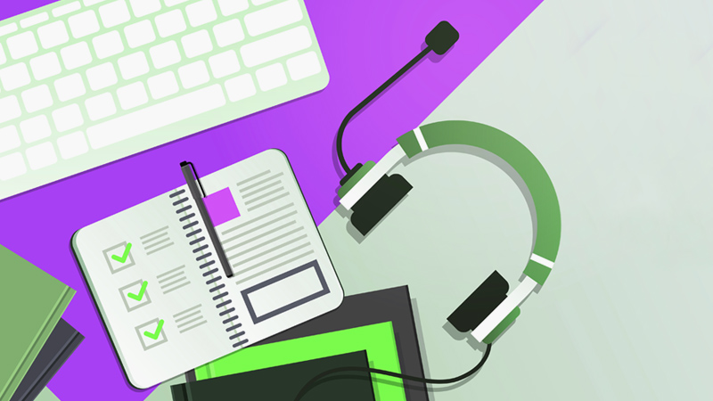 Illustration of IT service desk equipment, including: a keyboard, a headset and a notebook