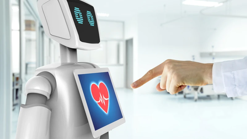 Robot with tablet on its torso and medical professional interacting with it