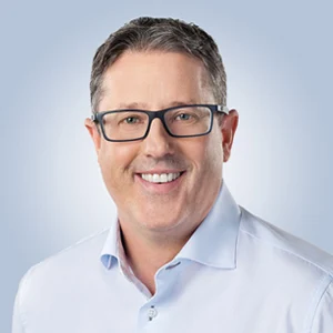 Headshot of Jason Macdonnell, Acting CEO of TELUS Digital, and President, TELUS Digital Customer Experience