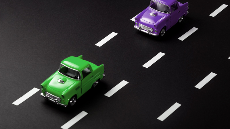 model cars driving in the same lane