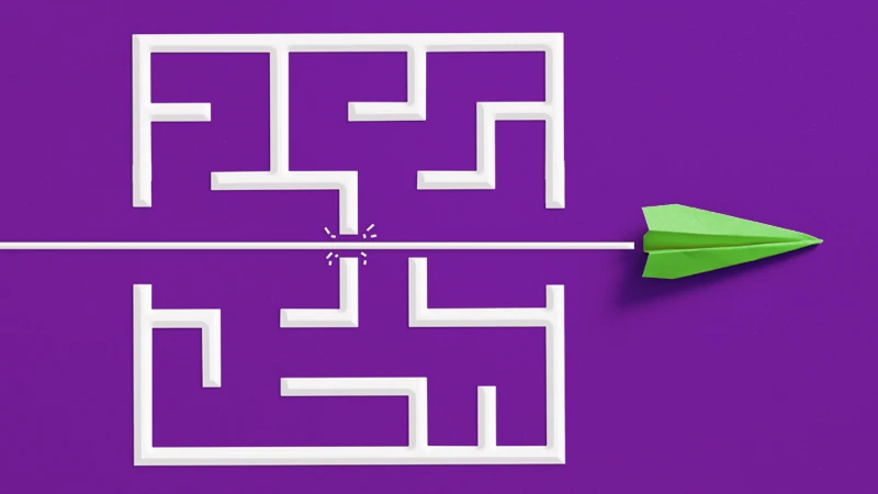 Illustration of a paper airplane breaking through a maze, used to symbolize overcoming challenges